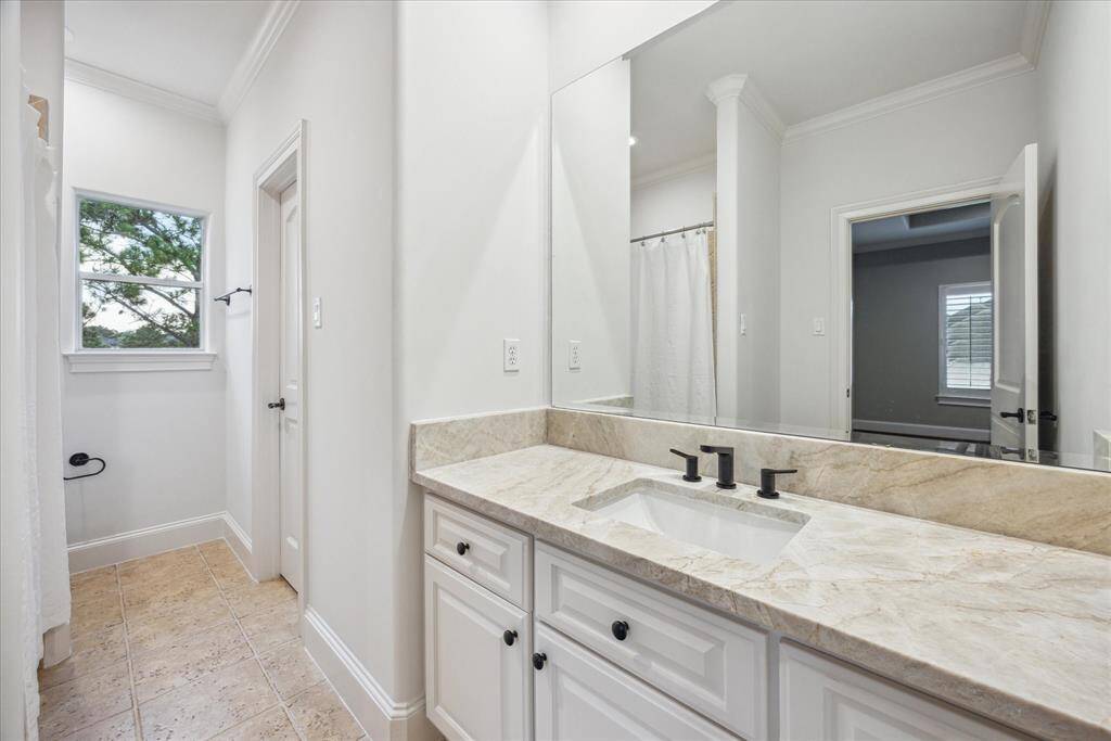Each bedroom includes a private ensuite bath featuring 2025 upgrades such as Taj Mahal countertops, sleek new hardware, and clean, modern finishes.
