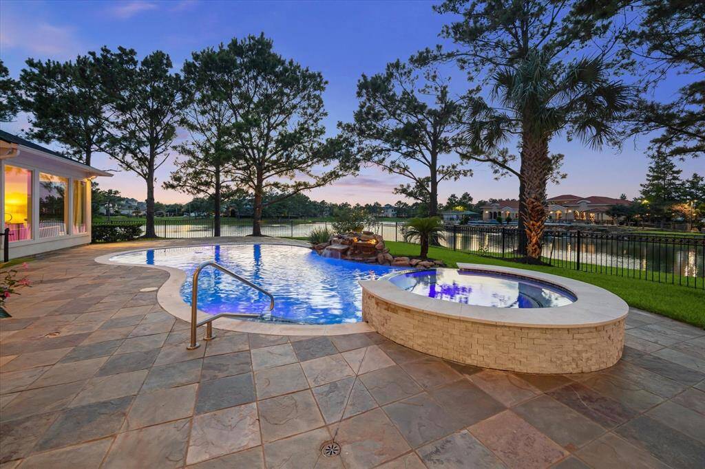 Enjoy easy access to the pool from the main living area and both bedrooms. The pool and spa were resurfaced in 2022, featuring a pebble finish and decorative tile accents with waterfall feature.