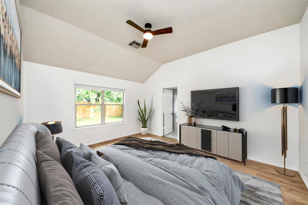A view of your primary bedroom staged