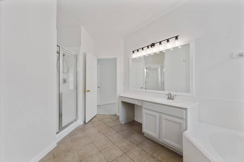 Hers with vanity-makeup area... stand up shower.