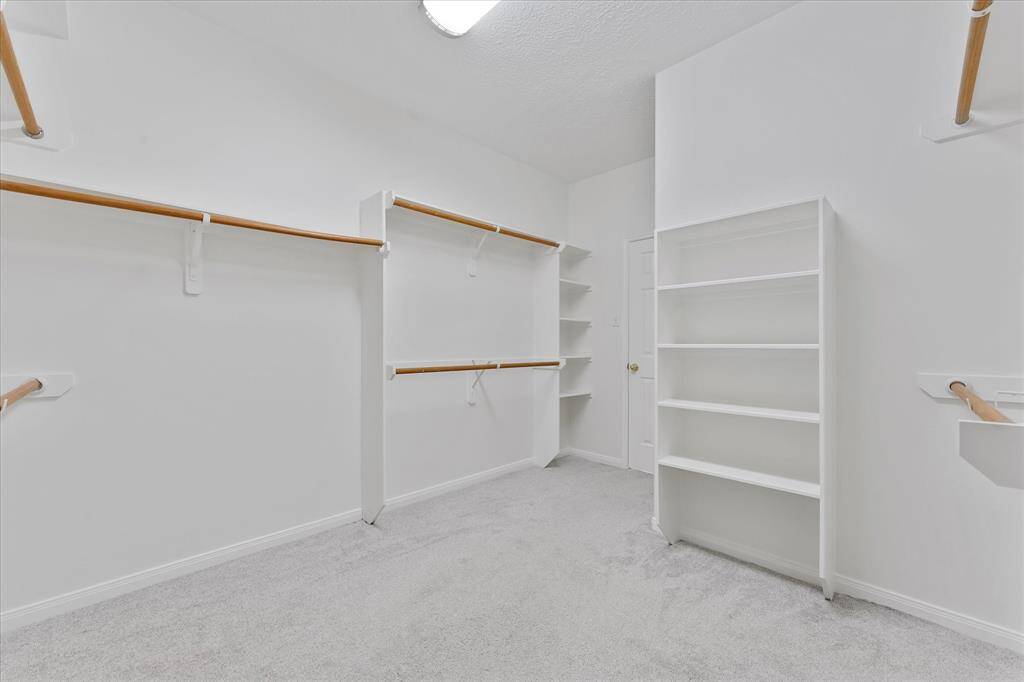 Master closet with plenty of space to add an island...