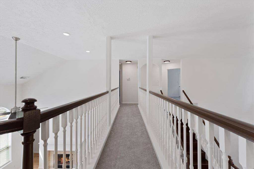 Open walkway to more bedrooms and gameroom...