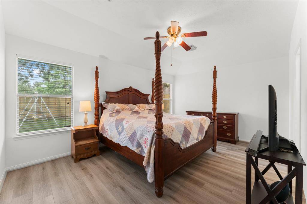 Primary suite has two large windows overlooking backyard.
