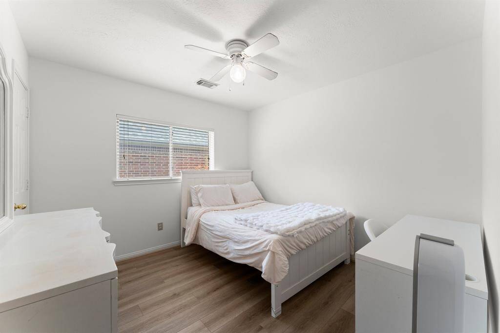 Bedroom 2 has ample space, large window, and walk-in closet.
