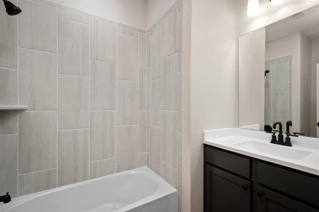 Your guests will love this beautiful, tiled shower, modern vanity and upgraded fixtures.