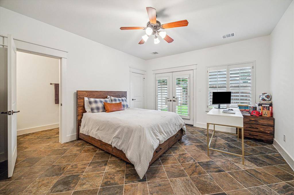 First floor secondary bedroom easily fits a queen bed with office desk