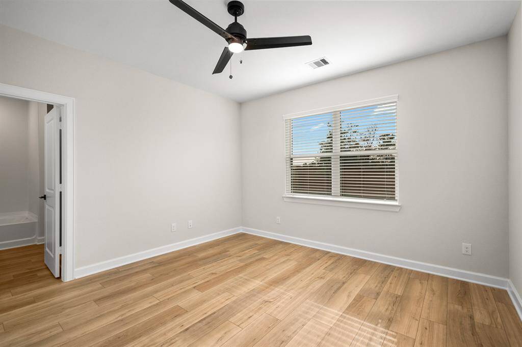 The master bedroom is filled with natural light and a warm and welcoming environment.