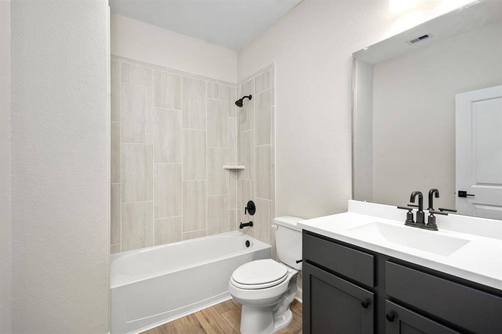 Your guests will love this beautiful, tiled shower, modern vanity and upgraded fixtures.