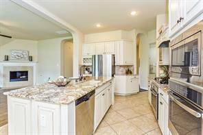 Love the open concept floorplan with the island kitchen looking out to the family room.