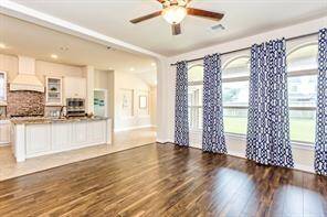 The wall of windows in the family room fill the home with natural light!