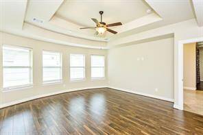 This angle shows how spacious this light and bright primary bedroom is.
