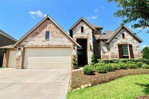 Lush landscaping and stunning curb appeal nestled in desirable Riverpark. "Home is Occupied "