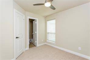 View of the fourth bedroom with an en-suite bath