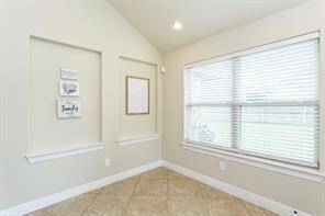 This light and bright breakfast area offers great views of the backyard.