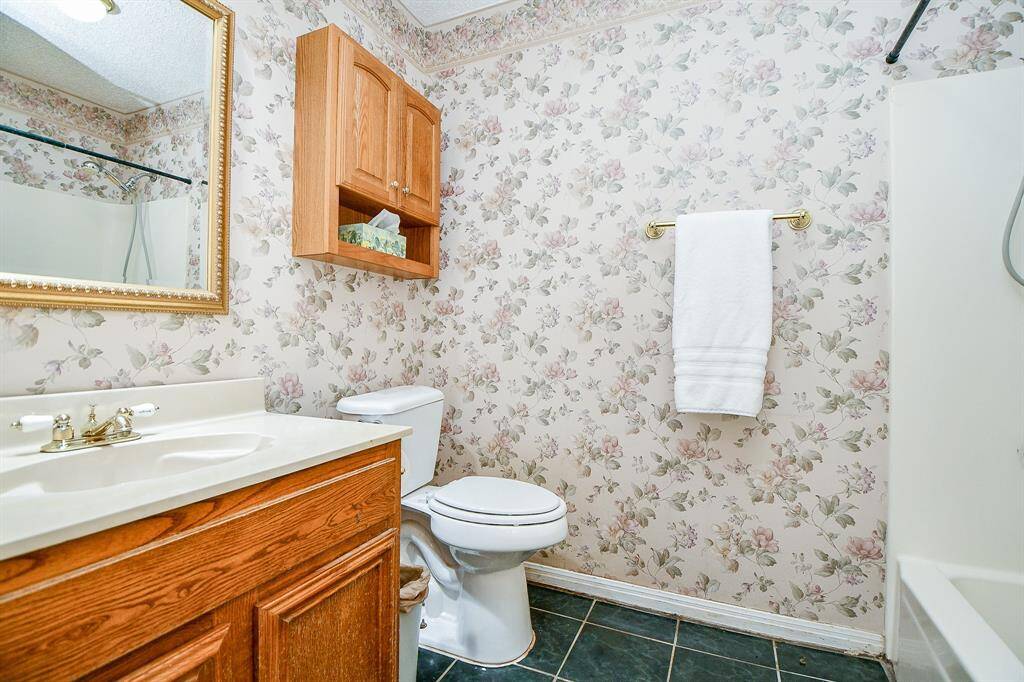 The hall bathroom has a shower/tub combination. It is located between the two secondary bedrooms.