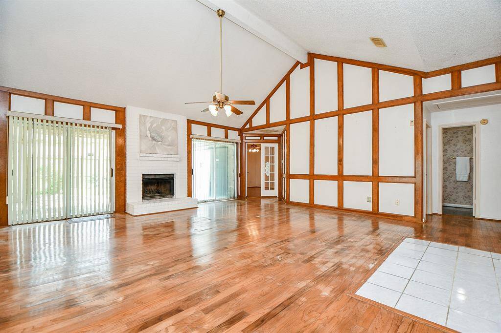 This is the large family room that welcomes you as you enter the home. The soaring ceiling height adds drama to the space.