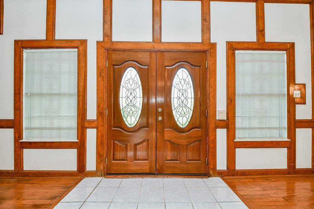 The entry with double doors and leaded glass inserts to allow for extra light.