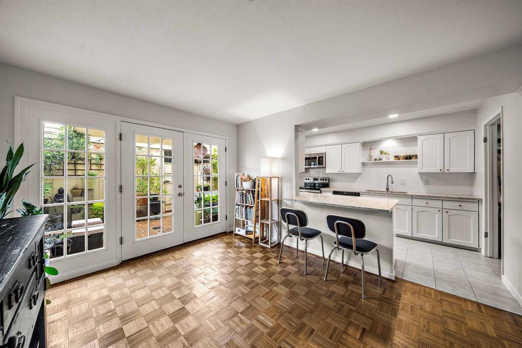 Double French patio door and kitchen. The back door opens to your private patio and extends your dining area. Ideal for entertaining or for nice relaxing mornings.