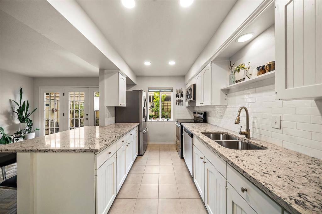 Another view. There is a window to the patio in the kitchen offering more natural ligh. The microwave has an actual exhaust fan that leads outside.