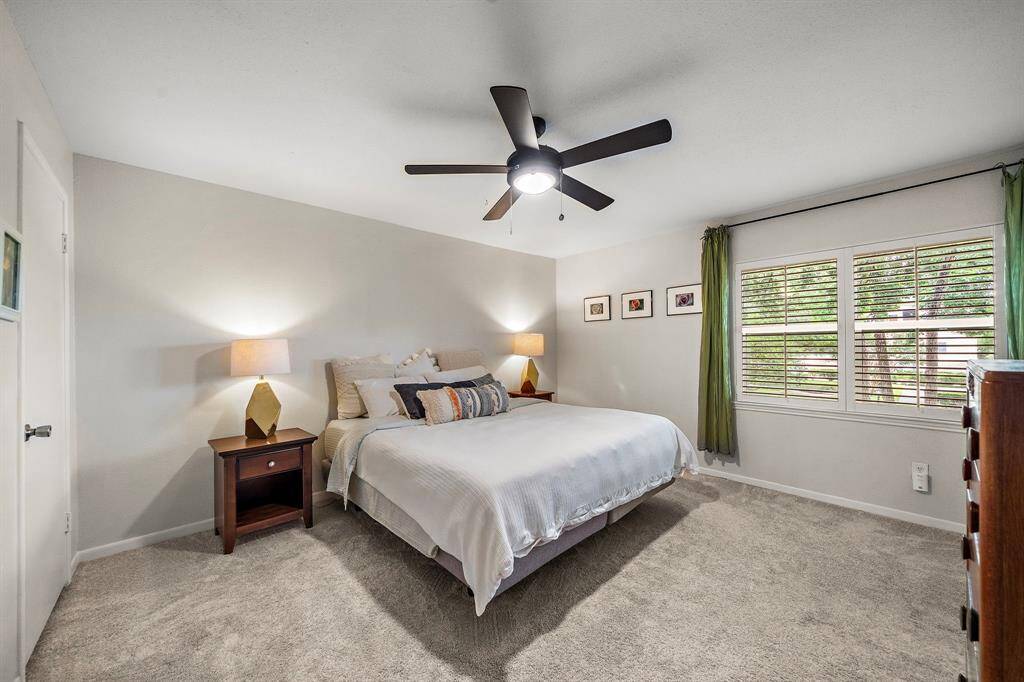 Welcome to this large and bright primary room. Beautiful views to the park, this room will instantly become your sanctuary. You can see one of the 3 closets to the left.