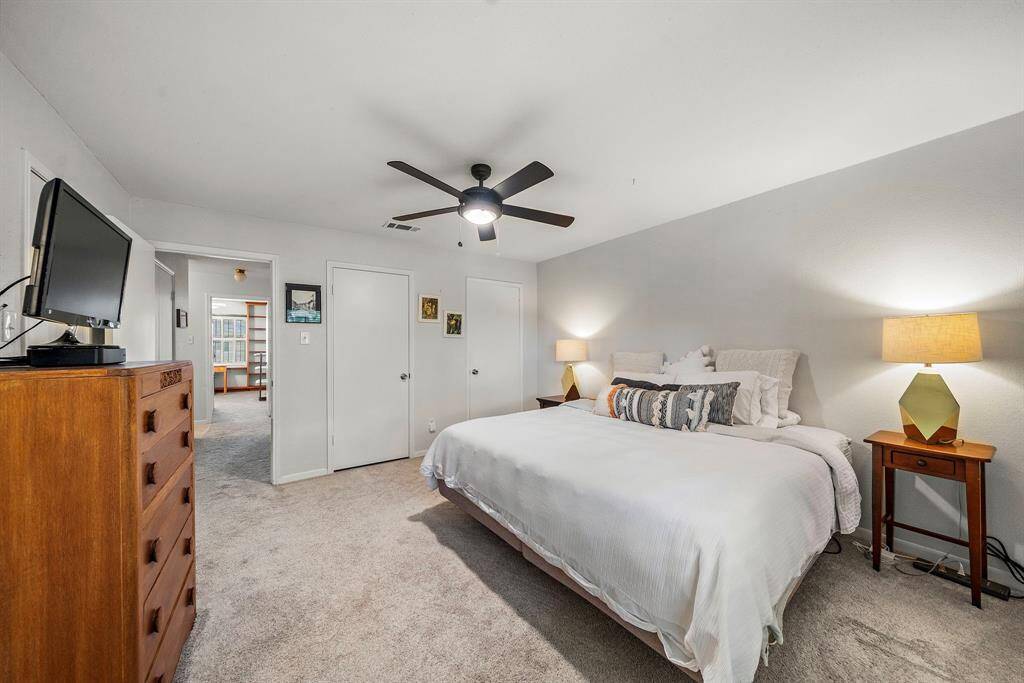 Another view of the primary bedroom. There is a third walk in closet to the left.