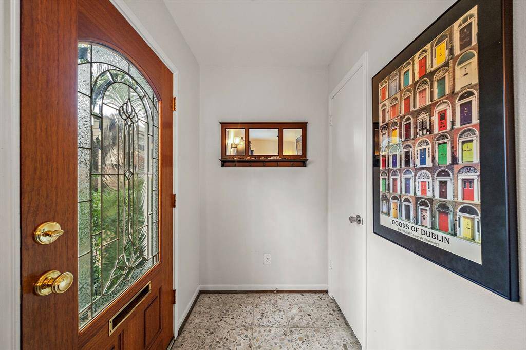 Foyer with a door to a coat closet.