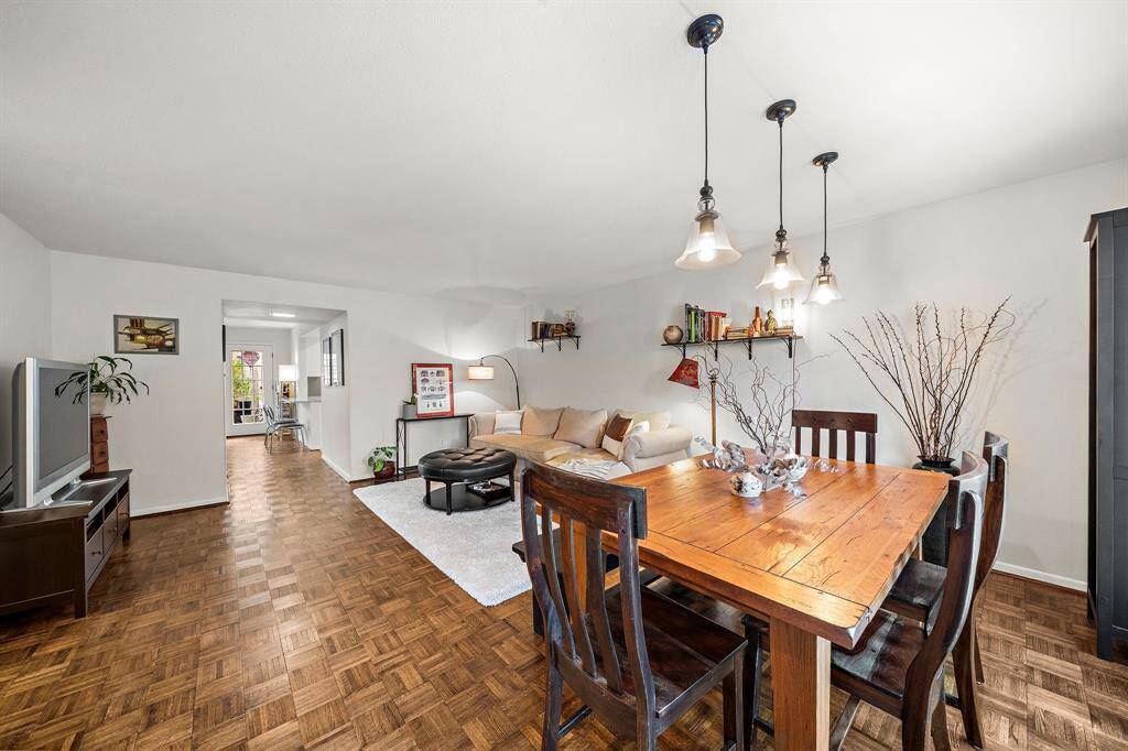 The front door opens to this meticulously maintained living/dining space. The hardwood floors are in great conditions.