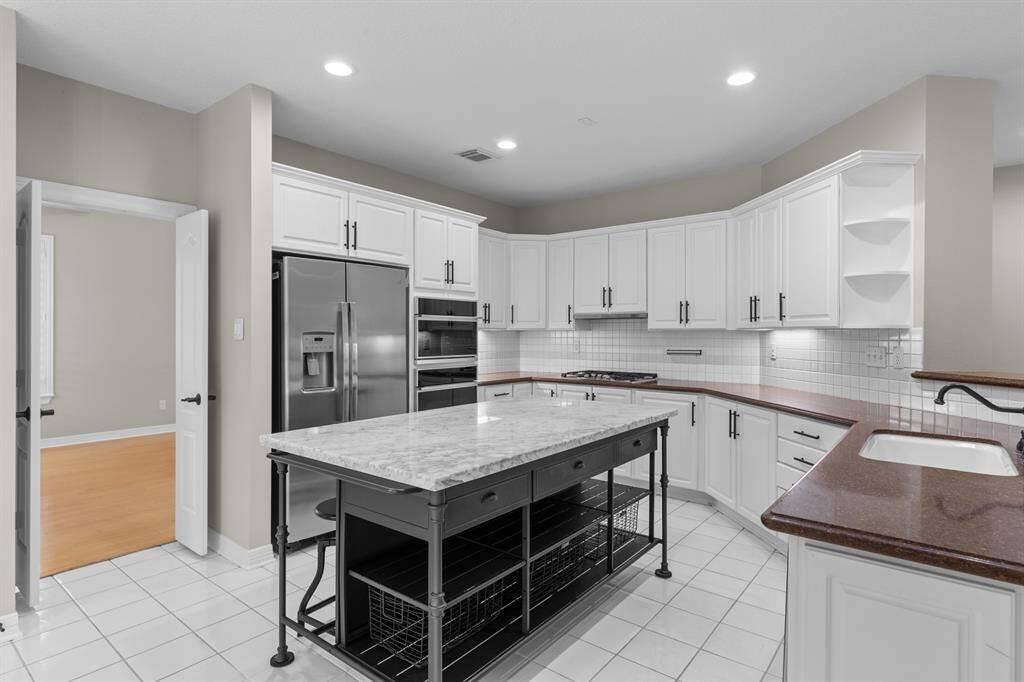 Kitchen Island is Crate and Barrel, and is not attached, but is staying