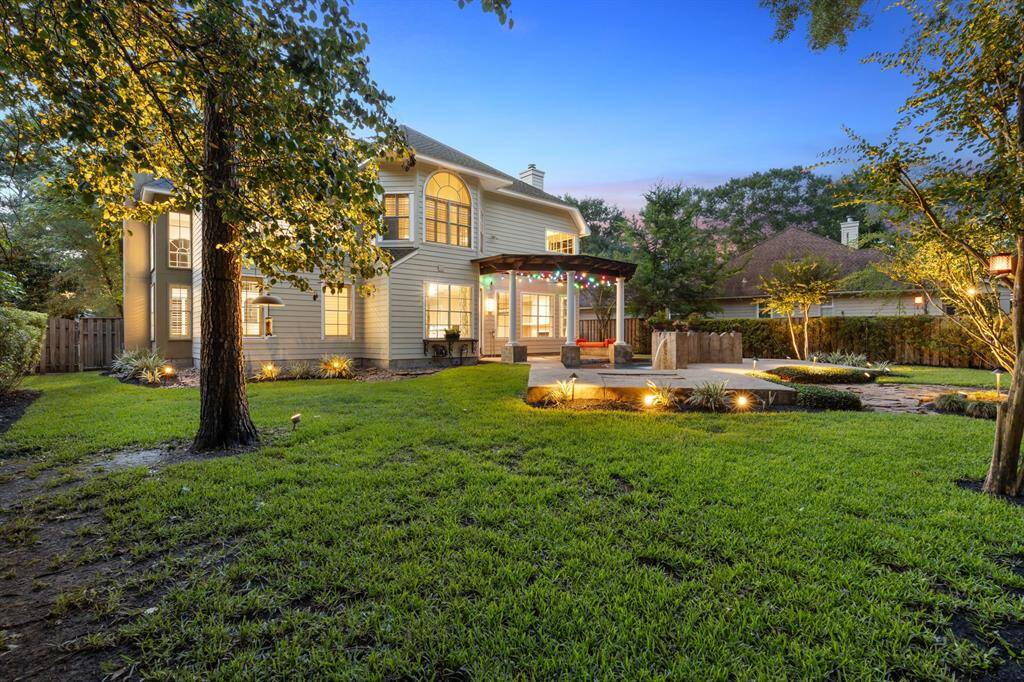 Landscape lighting throughout, both front and back yard