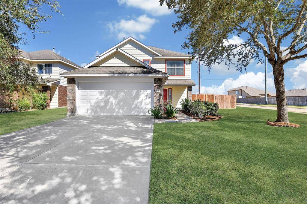 Plenty of space for parking in the 2-car garage and driveway.