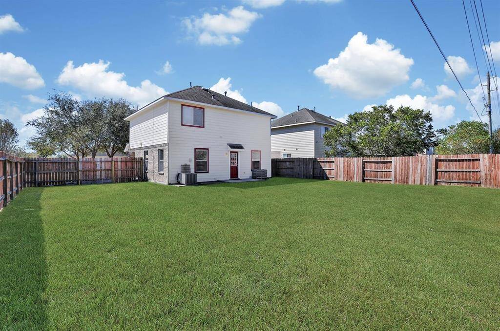 Step out into the fenced backyard.