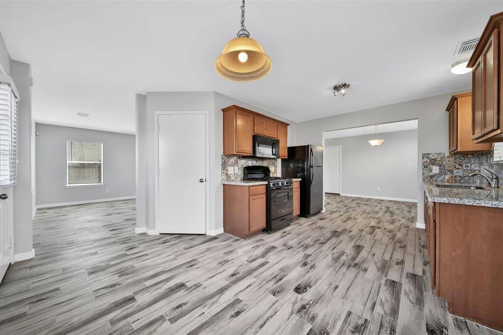Here is a view of the kitchen from the breakfast room. The dining room is conveniently accessed from the kitchen.