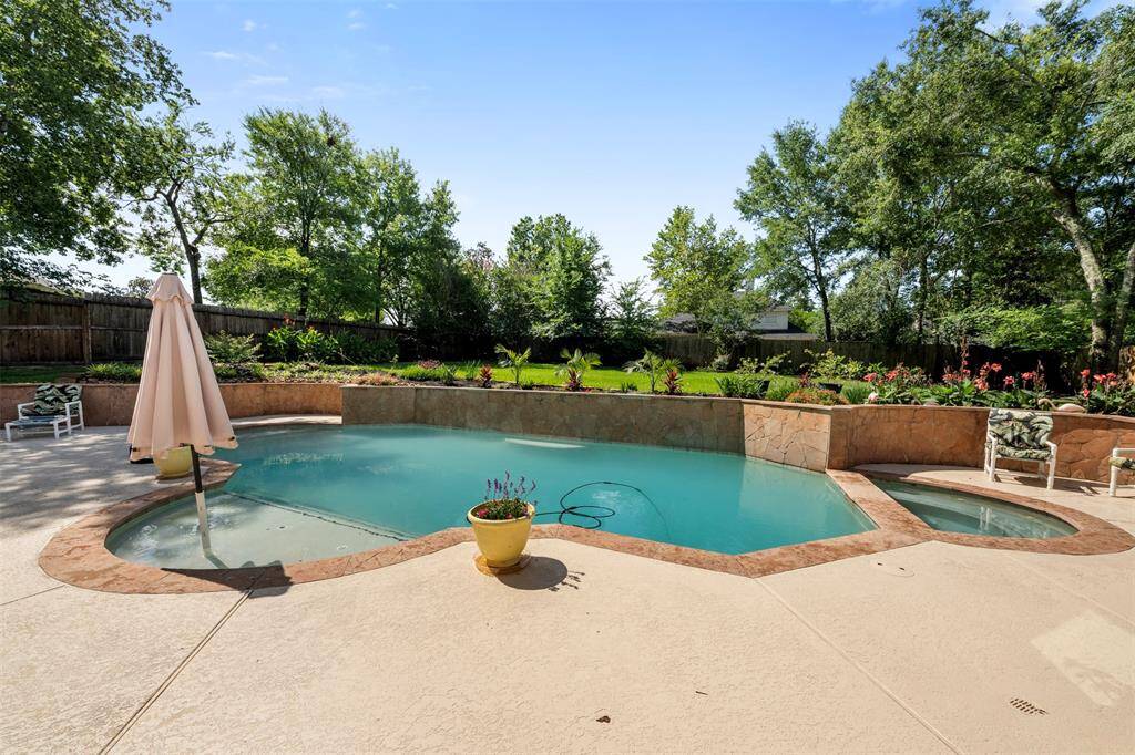 Custom salt water pool with a diving wall