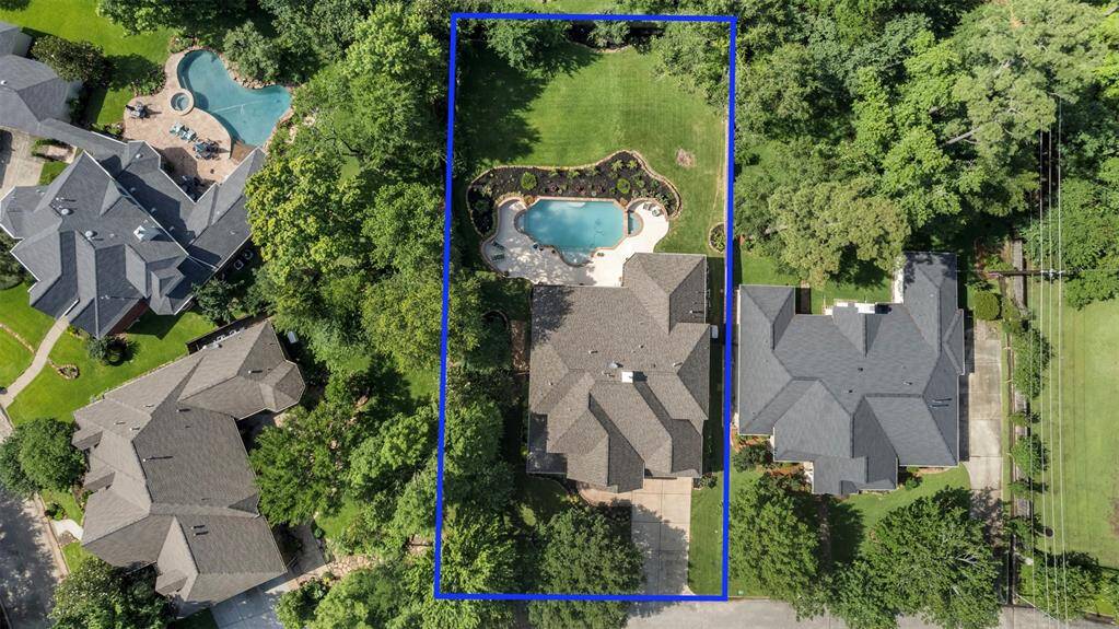 Property lines showcased in this top-down drone view, emphasizing the generous lot and private pool setting