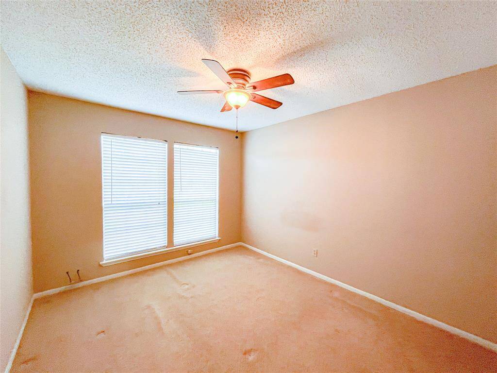 3rd bedroom to the right at the end of the hallway upstairs