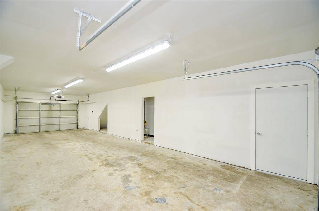 First floor garage on main house with full passthrough to rear of home.