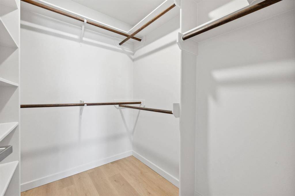 The primary suite includes spacious closet with custom shelving