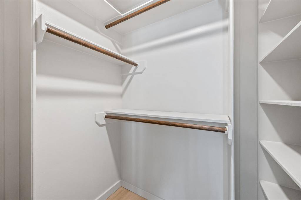 This bedroom features a walk-in closet with