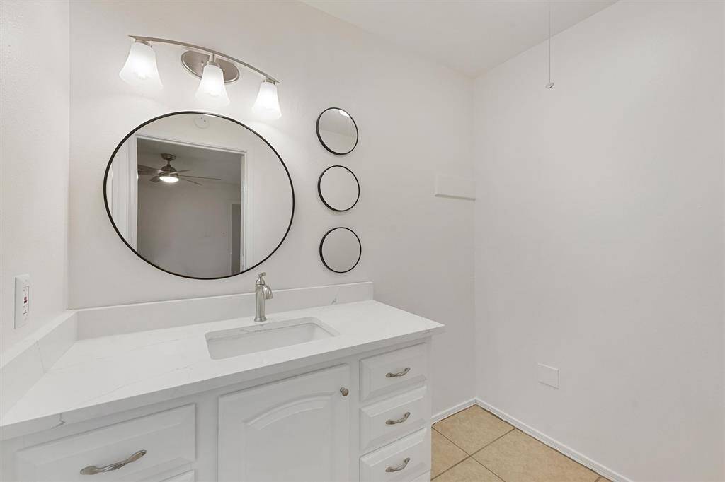 Updated vanity, lighting, mirrors, and an extra space that could be for built-ins,, furniture, and an extra closet!