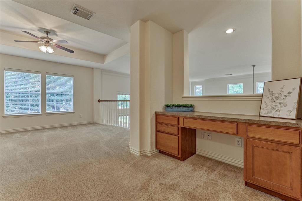 Built in desk for designated office space uptairs.