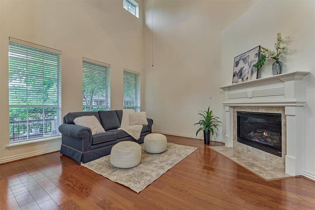 Gleaming wood floors and an entertainment niche.
