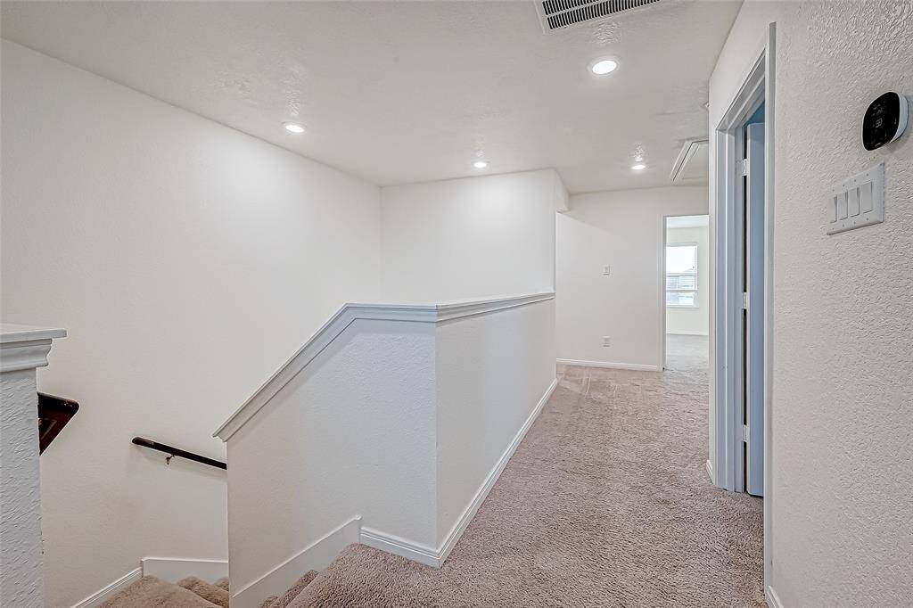 The second floor provides ample space for both play and rest, featuring a large game room, a posh owner’s retreat with a luxurious ensuite bathroom, two guest bedrooms, and a second full bathroom.