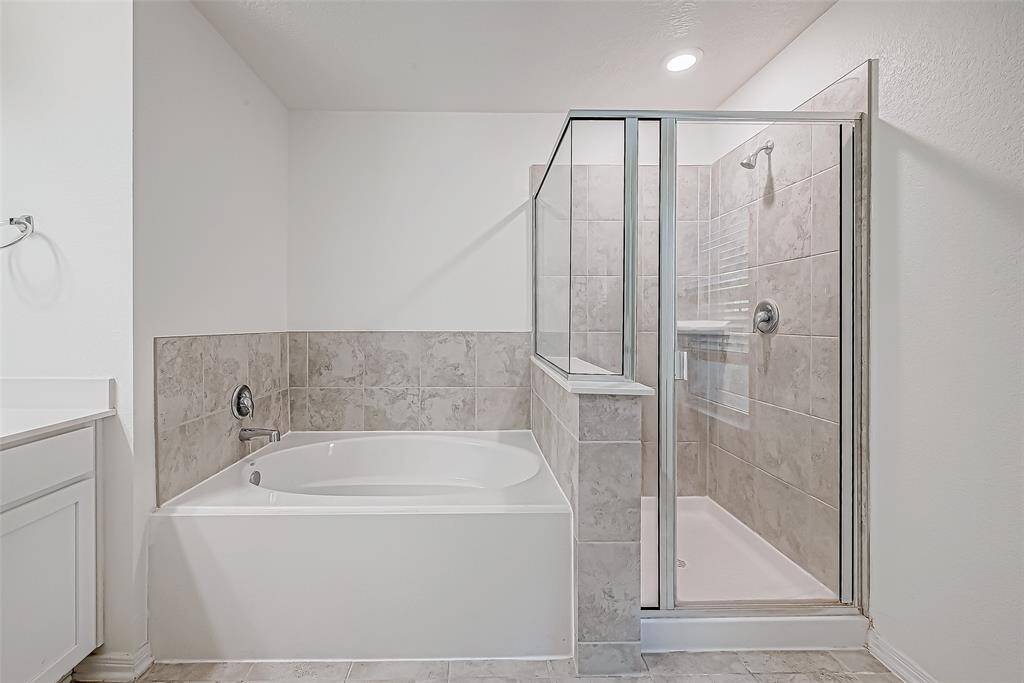 Relax and soak your worries away in this luxurious soaking tub or enjoy a quick rinse in the spacious walk-in shower. Either way, you'll love this private retreat.