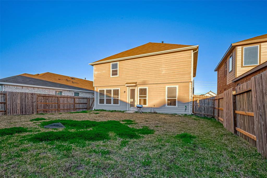 This spacious backyard provides plenty of room for outdoor fun, gardening, or simply relaxing under the open sky. The fenced yard ensures privacy and a safe space for little ones and pets to play freely.