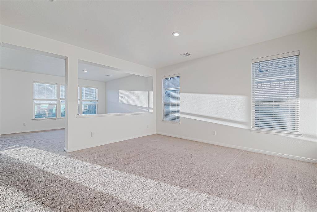 The flexible floor plan features two open and sunlit living areas on the first floor, a bright front living room and a spacious family room at the back, offering plenty of space for everyday living and entertaining.