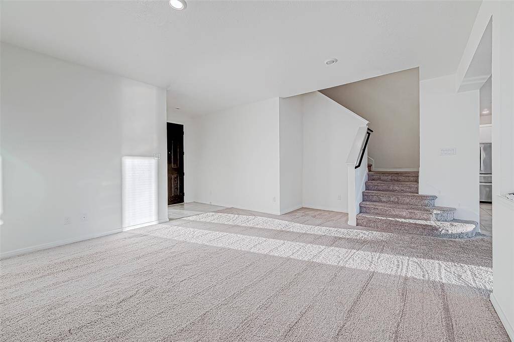 Anchored at the front of the home, this bright and open space adapts to your needs. It's ideal for welcoming guests, creating a stylish sitting area, or expanding your everyday living area.