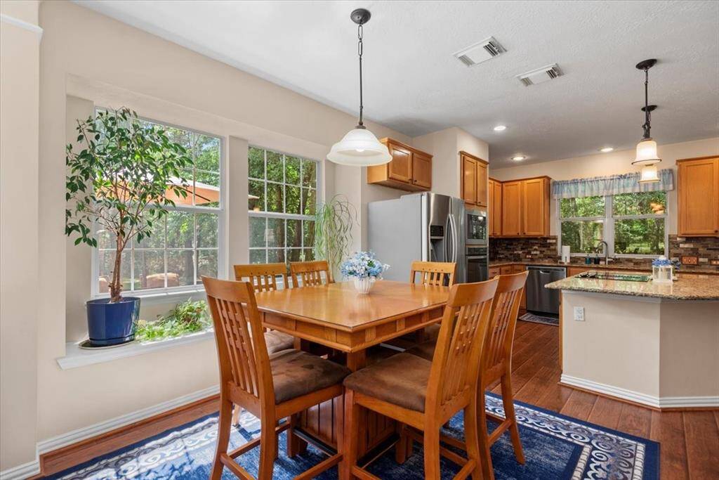 Breakfast area is open to sun room, kitchen and living room.