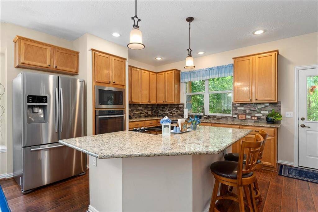Cook's dream kitchen! Has tons of storage, huge island, walk-in pantry, built-in microwave and convection oven.