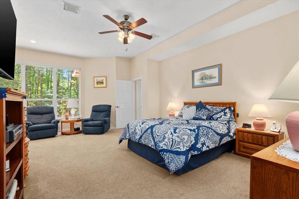 Huge primary bedroom on first floor with sitting area, large ensuite and walk-in closet.
