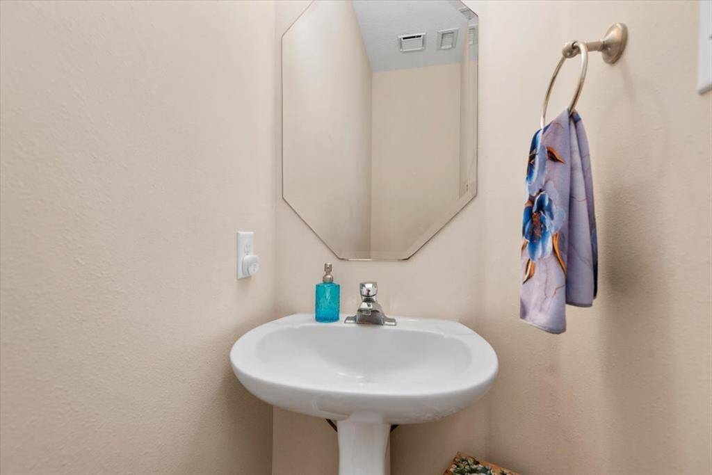 Cute powder room for guests tucked away on the first floor.
